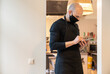 © Hernandez & Sorokina/Stocksy - Chef Using Cellphone