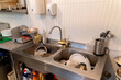 © Hernandez & Sorokina/Stocksy - Dirty Dishes Inside Of Sink