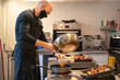 © Hernandez & Sorokina/Stocksy - Chef Filtering Oil At Kitchen