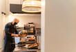 © Hernandez & Sorokina/Stocksy - Cook Working At Kitchen