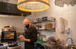 © Hernandez & Sorokina/Stocksy - Chef Checking Smartphone At Kitchen