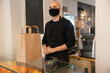 © Hernandez & Sorokina/Stocksy - Chef Waiting To Give Take Away Order