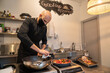 © Hernandez & Sorokina/Stocksy - Chef At Kitchen