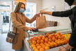 © Hernandez & Sorokina/Stocksy - Woman Paying Her Take Away Order