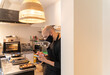 © Hernandez & Sorokina/Stocksy - Chef Using Smartphone At Kitchen