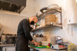 © Hernandez & Sorokina/Stocksy - Chef Cutting Vegetables At Kitchen
