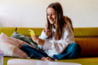 © Eloisa Ramos/Stocksy - Teen girl making a video chat with the mobile