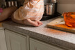 © Jennifer Bogle/Stocksy - Girl perches on kitchen counter