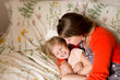 © Jennifer Bogle/Stocksy - Mother hugs laughing daughter
