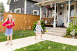 © Jennifer Bogle/Stocksy - Sisters play in yard full of tiny bubbles
