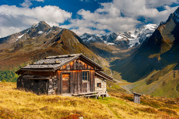 Poster - panoramic mountain range with wooden hut