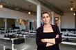 © McKinsey Jordan/Stocksy - Woman Stands In Fitness Studio