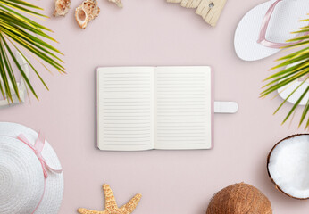 Wall Mural - Notebook on beach surrounded by summer vacation accessories, shells and coconut. Empty notebook for text promotion
