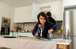 © Valentina Barreto/Stocksy - kid serving the table at home