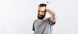© Daria Lukoiko - Portrait of handsome young man frowning while holding hands near head on white background with space for advertising mock up
