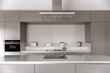 © Andriy Bezuglov/Stocksy - Interior of modern kitchen with white walls