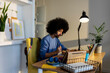 © Valentina Barreto/Stocksy - latin afro man working at home