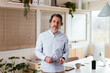 © BONNINSTUDIO/Stocksy - Middle aged man standing near desk in home office