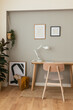 © BONNINSTUDIO/Stocksy - Decorations around table in home office