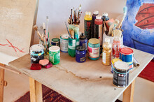 Paints And Brushes On An Artist's Table