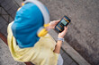 © Santi Nuñez/Stocksy - Muslim Runner Using Phone