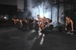 Muscular Sportive People performing dead lift barbell exercises together, having workout at industrial gym. Group training, teamwork concept. Bodybuilding, sport concept