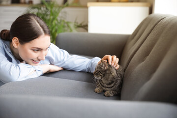 Sticker - Beautiful young woman with cute cat at home