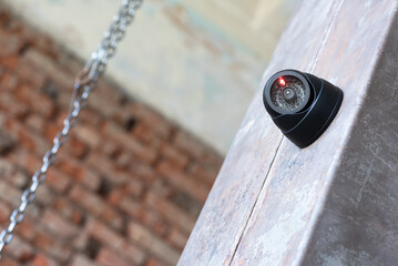 CCTV security camera on the wall close up background.