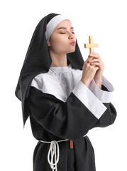 Wall Mural - Young nun with cross on white background