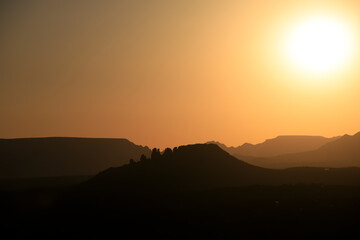 Sticker - Colorful sunset over a desert mountain landscape