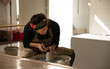 © Malquerida Studio/Stocksy - Ceramist young woman Making Clay vase With Pottery lathe in her studio