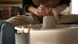 © Malquerida Studio/Stocksy - Close up of ceramist woman Making Clay bowl With Pottery lathe in her studio