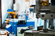 © David Prado/Stocksy - Milling machine in bright workshop