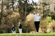 © Sergio Marcos/Stocksy - Women playing golf in park