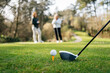 © Sergio Marcos/Stocksy - Women playing golf in park