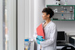© Hernandez & Sorokina/Stocksy - Doctor Holding Folder At Clinic