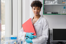 Scientist Holding Folder