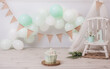 Fantastic mint colored birthday cake for a girl's or boy's birthday. Boho chic birthday photoshoot. First year photoshoot. Smash the cake photoshoot.