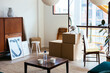 © BONNINSTUDIO/Stocksy - Boxes and furniture in new flat