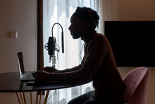 Black Man Singing At Home