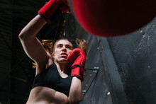 Energetic Boxer Punching Bag In Gym