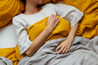 © BONNINSTUDIO/Stocksy - Unrecognizable woman sleeping in bed at home
