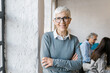© Mihajlo Ckovric/Stocksy - Portrait of a confident senior businesswoman in the office