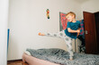 © Olga Moreira/Stocksy - Boy having fun on bed