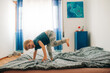 © Olga Moreira/Stocksy - Boy having fun on bed
