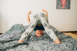 © Olga Moreira/Stocksy - Boy having fun on bed
