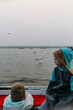 © Amanda Voelker/Stocksy - Two young children together on a boat at sunrise the Ganges