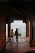 © Amanda Voelker/Stocksy - Back view of a young boy and girl walking through an Indian Palace