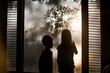 © Amanda Voelker/Stocksy - Two Children drawing on steamy windows