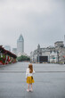 © Amanda Voelker/Stocksy - A little girl stands on the Bund in Shanghai, China